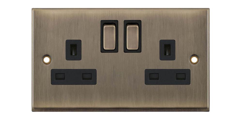 2-Gang 13 Amp Socket DP Switched Antique Brass with Black Inserts